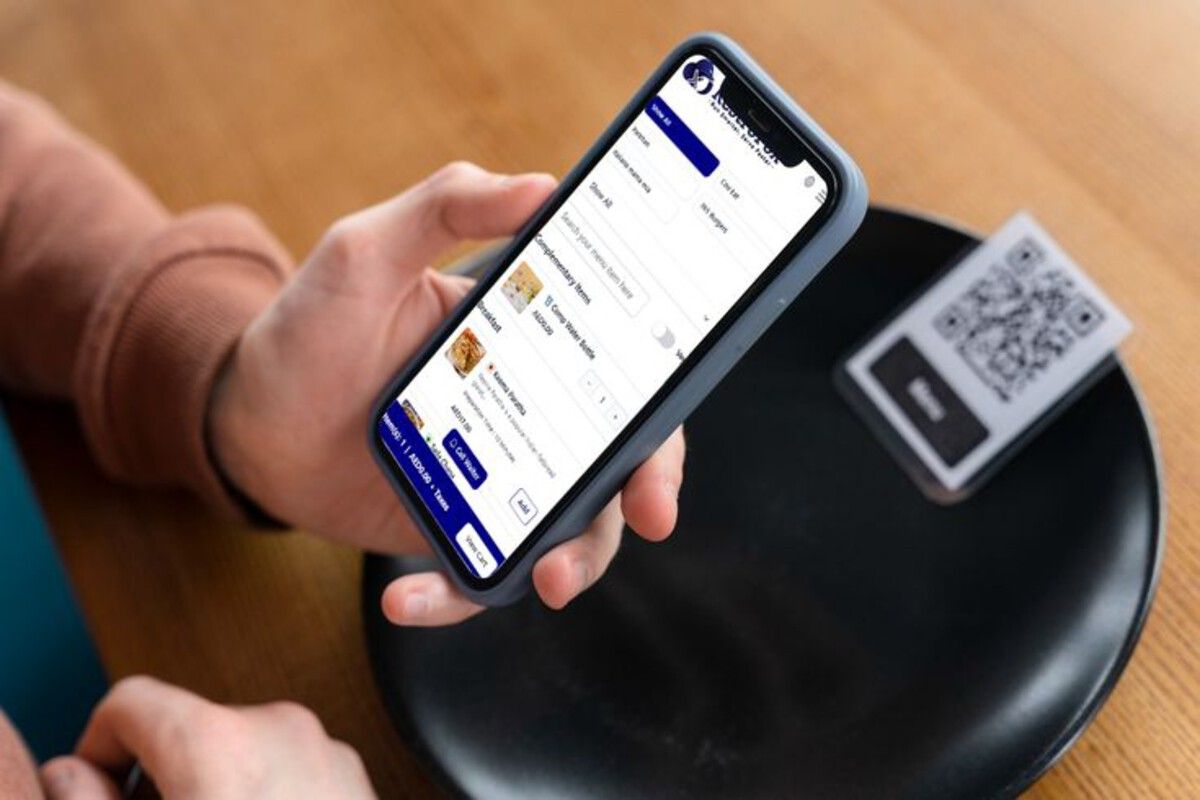 guest-browsing-digital-menu-at-table