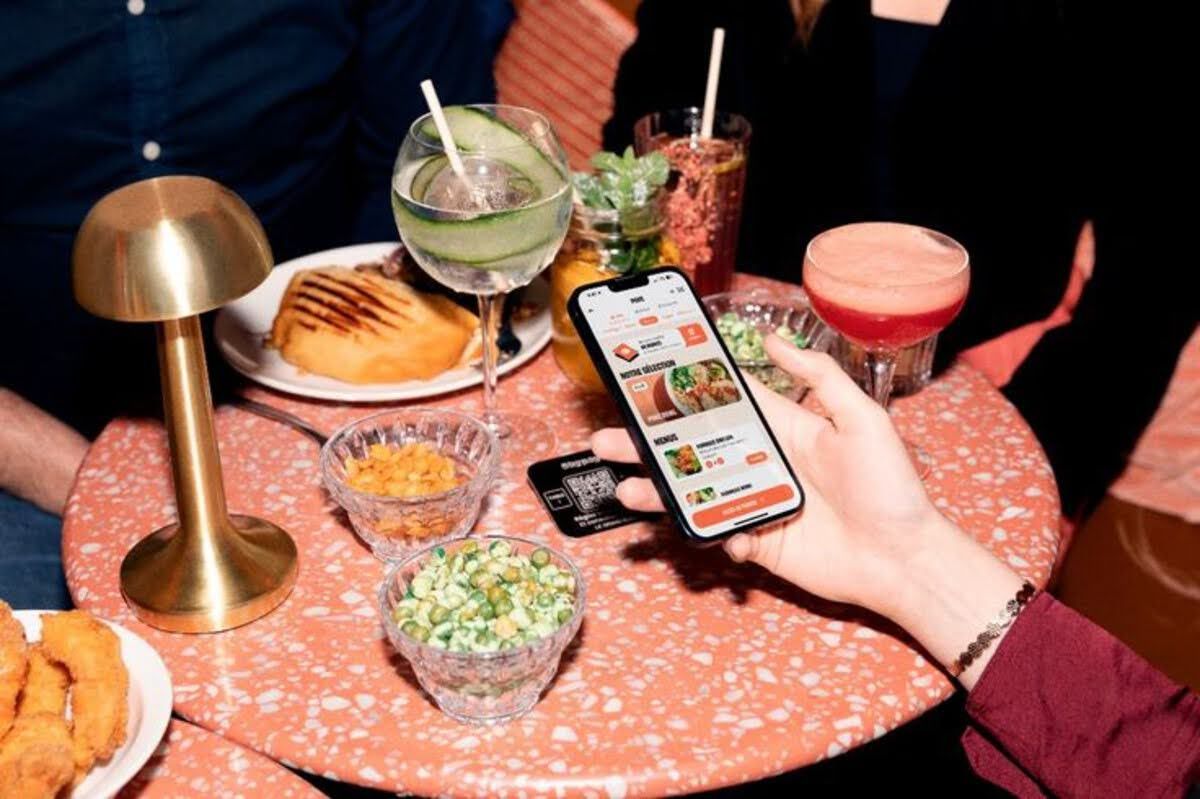 guest-browsing-digital-menu-at-table