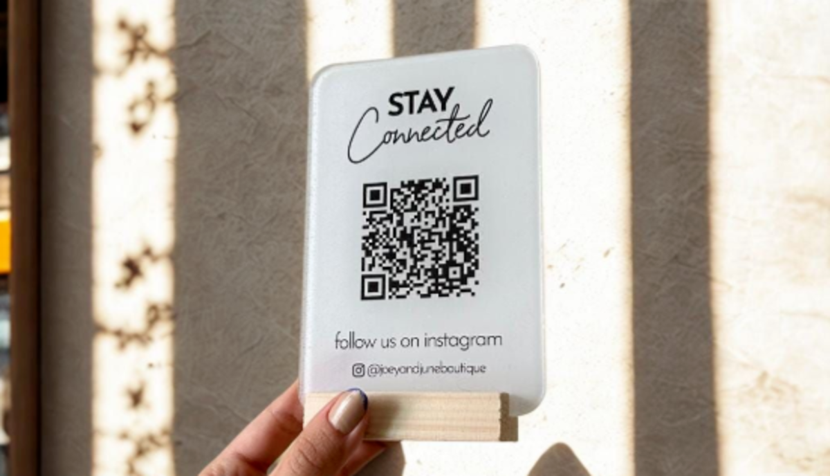 a-branded-qr-code-stand-inviting-customers-to-follow-on-instagram